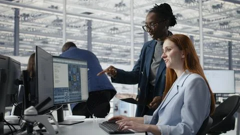 Examining semiconductor substrate, working together and women in office Stock Photos