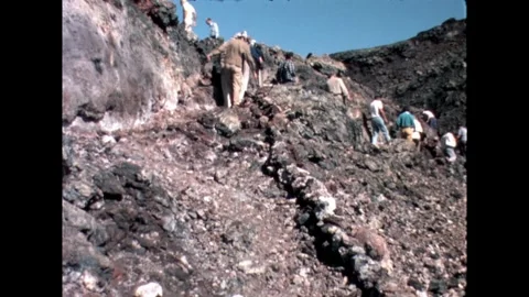 Examining Volcanic Rocks Stock Footage 278331946