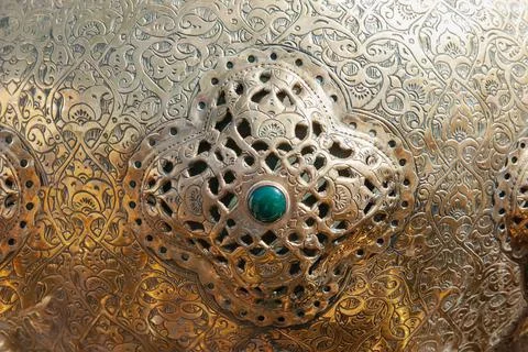 An Example Of Artistic Patterns On Metal. Fragment of a metal object with an Stock Photos
