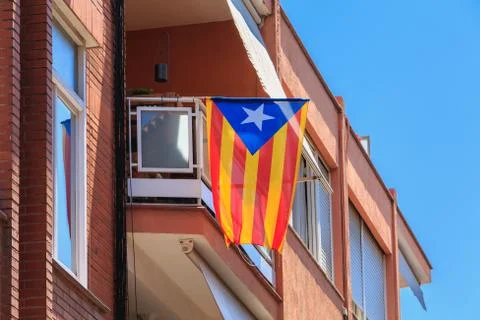 Example of a building facade in a residential area with Catalan flag Stock Photos
