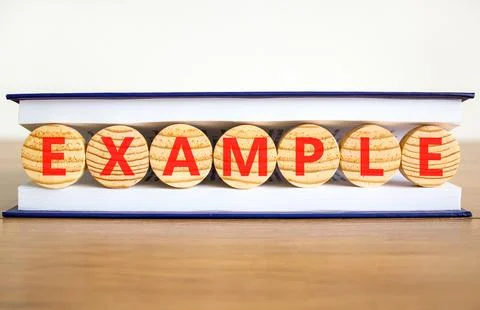 Example examples symbol. Concept word Example on beautiful wooden circles i.. Stock Photos