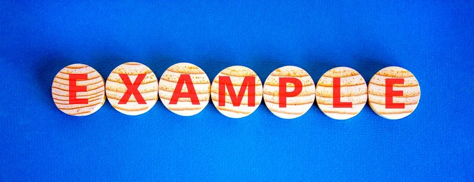 Example examples symbol. Concept word Example on beautiful wooden circles. .. Stock Photos