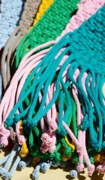 An example of the macrame technique, a square knot made of multi-colored th.. Stock Photos