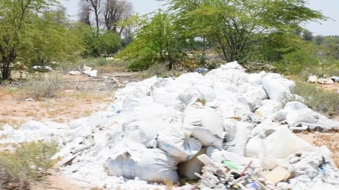 An example of plastic and other litter or garbage thrown in the desert Stock Footage 108982276