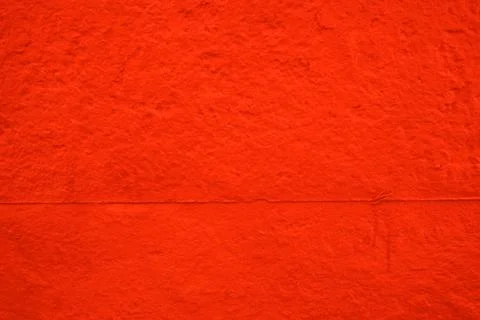 Example of a red rough concrete wall. Stock Photos
