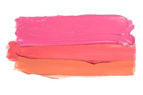 Examples of different shine lip glosses flowing downwards on a white background Stock Photos
