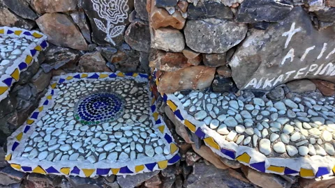 Examples of mosaics patterns created from sea pebbles by an amateur artist as Stock Footage 301779407