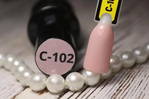 Examples of nails tips on pastel background top view. Stock Photos