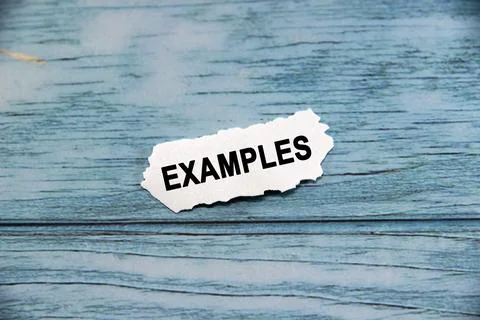 Examples wording  or text on small piece of hard white plastic with blue ba.. Stock Photos