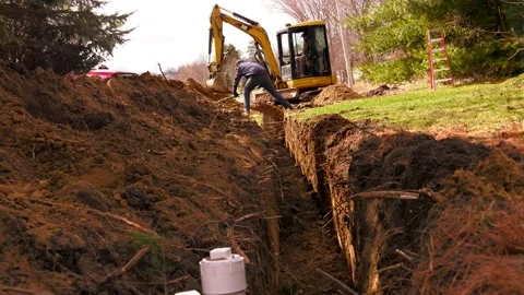  Excavating crew installs pipe underground 01610049 Stock-Footage 153242911