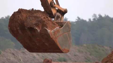 Excavating machine at work. Heavy machinery for earth moving. Video stock 296086628