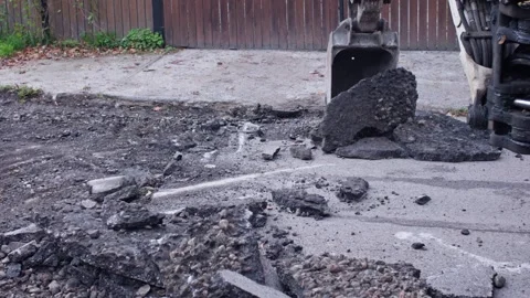 Excavation Process The Task of Removing the Asphalt Surface Involving Heavy Video stock 320847179