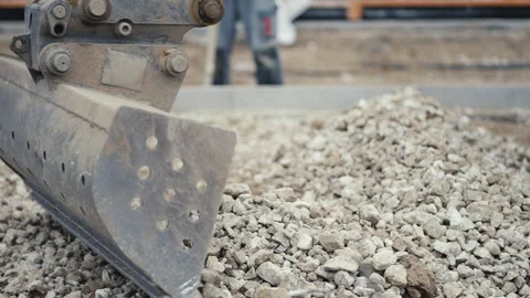 The Excavation Process Utilizing Heavy Machinery at the Construction Site for Stock Footage 312634028