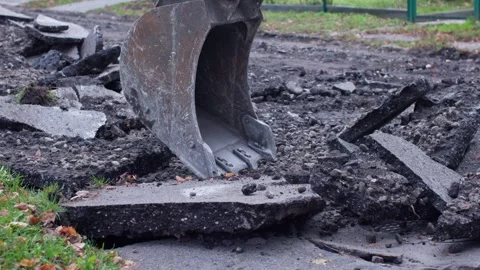 Excavation Process Utilizing Heavy Machinery on Compromised Pavement for Repair Video stock 314710295
