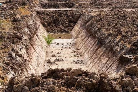 Excavation techniques for constructing irrigation canals in dry rural envir.. 写真素材