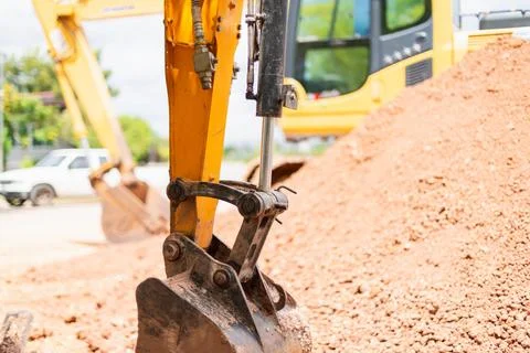 Excavation work in construction site heavy machinery focus urban environmen.. Stock Photos