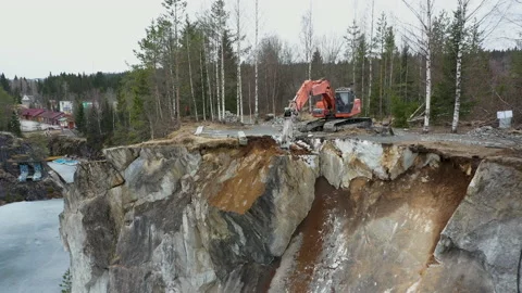 Excavation work on a rock in Karelia Stock Footage 138657384