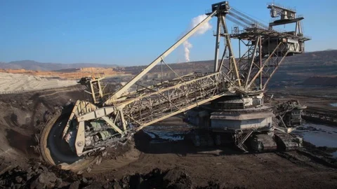 An excavator from above operating in a coal mine in Greece Stock Footage 120930604