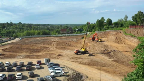Excavator and crane work on ground at construction site Stock Footage 227774290