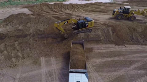Excavator and loader  working on a construction site Stock Footage 47926375