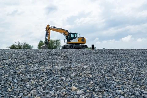 Excavator and plane Stock Photos