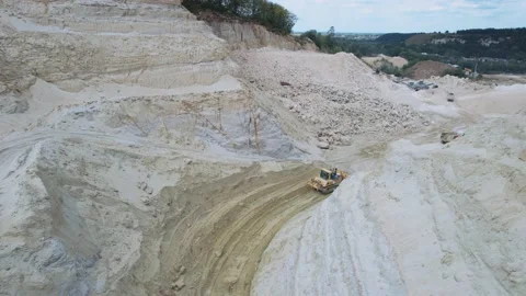 Excavator and quarry aggregate working on sand quarry. Drone shot of industrial Stock Footage 219951582