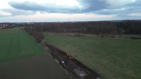 Excavator and tractor standing on a construction site removing railroad trac Stock Footage 236321194