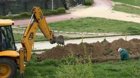 Excavator and worker Video stock 74950060