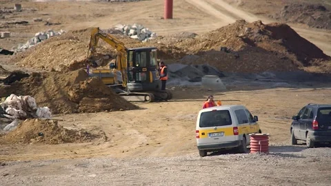 Excavator and workers on a construction site Stock Footage 150499723