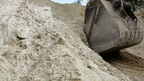 Excavator arm is digging the sand on a modern construction site Stock Footage 89931146