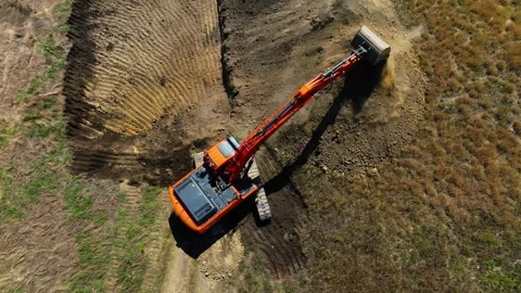 Excavator with big shovel Excavator digging soil pits on construction site. Stock Footage 304563853