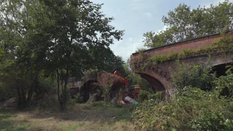 Excavator Breaking Brick Arches - Action Reveal Stock Footage 332353658