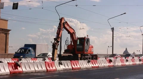 Excavator breaking road surface with hydrohammer drill at repairing roadwork Stock Footage 64846429