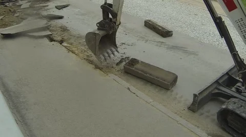 Excavator breaking sidewalk Stock Footage 67827741