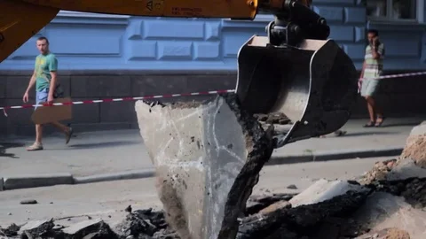 Excavator breaks the asphalt Stock Footage 72791795