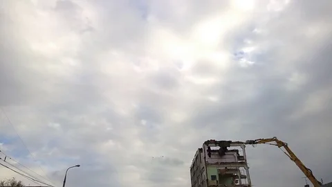 Excavator breaks part of the building wall 스톡 동영상 100460139
