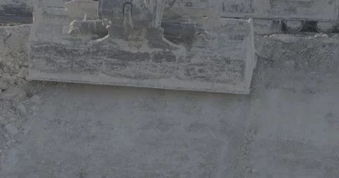 Excavator bucket collects earth, construction, land, levels the soil Stock Footage 305641253