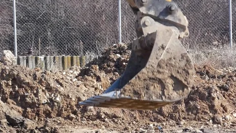 Excavator Bucket Compacting Soil Stock Footage 321773892