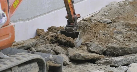 Excavator bucket digging and moving ground Stock Footage 170487914