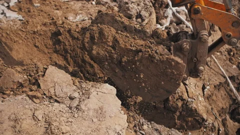 Excavator bucket digging the ground Stock Footage 237451120