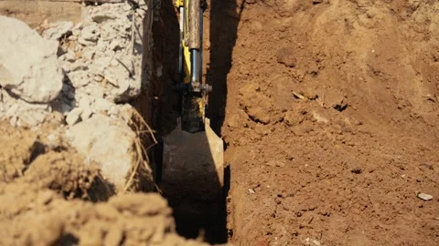 Excavator bucket digging trench in the ground 動画素材 341294622