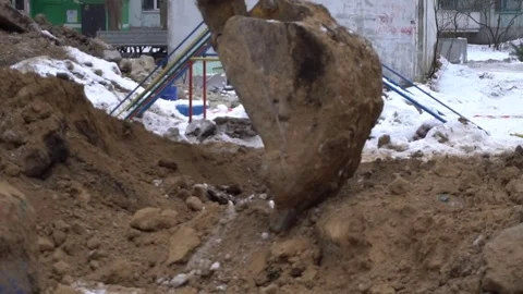 Excavator bucket digs the ground Видео 71613022