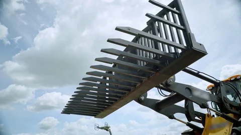 Excavator bucket for hay stack loading. Excavator arm. Agriculture equipment Vídeos de archivo 83521379