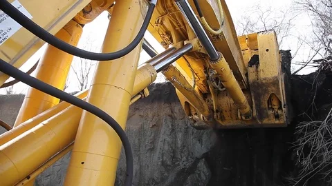 Excavator bucket loads the ground  Stock Footage 83537844