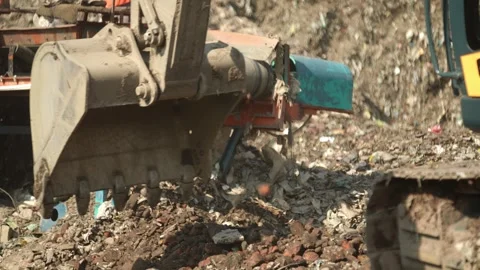 Excavator Bucket Scooping Garbage Close Up At Delhi Landfill Site Stock Footage 248058519