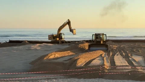 Excavator bulldozer working on beach Caparica, Portugal — June 11, 2025 Stock Footage 337059040