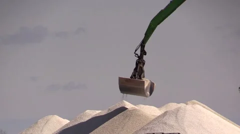 Excavator with clamshell grab unloading mineral material from coaster 스톡 동영상 48921063