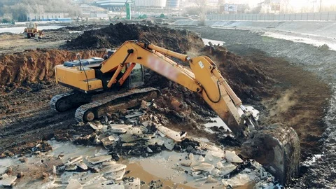 Excavator cleaning quarry. Construction equipment, heavy industry machinery. Stock Footage 126713098