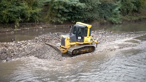 The excavator cleans the river - 2 Stock Footage 81374238