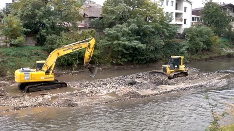 The excavator cleans the river Stock Footage 81374296